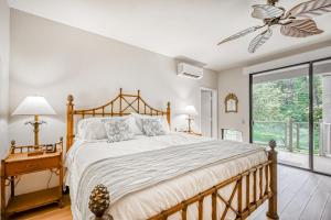 Ένα ή περισσότερα κρεβάτια σε δωμάτιο στο Wailea Grand Champions 26