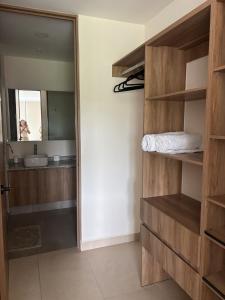 a bathroom with a sink and a mirror in a room at Baltia departamento in Mérida