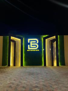 a group of doors with a sign on a wall at Best Eastern Hotel Multan in Multan