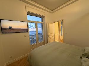 Postel nebo postele na pokoji v ubytování Vue Mer Panoramique - Appartement d'Exception