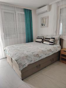 Postel nebo postele na pokoji v ubytování Studio ISKRA 2 Novi Sad