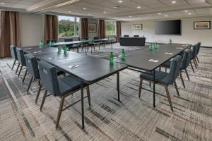 a conference room with a long table and chairs at Four Points by Sheraton Barrie in Barrie +62 photos