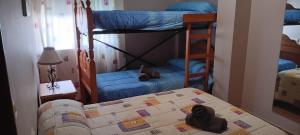 En eller flere senge i et værelse på Alojamientos El Risquillo + 19 billeder