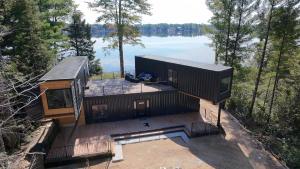 an overhead view of a house with a view of a lake at Unique 3-bed Lakefront Container Home in National City