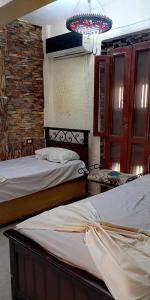 Postel nebo postele na pokoji v ubytování فيلا روز