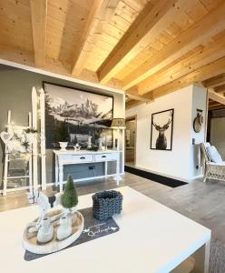 a living room with a large painting on the wall at Ferienwohnung Dahoam in Bernau am Chiemsee