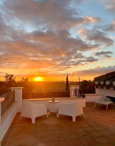 a view of a sunset from the roof of a building at Villa Alegre - 2 bed villa with private heated pool on Mar Menor Golf - family friendly in Torre-Pacheco