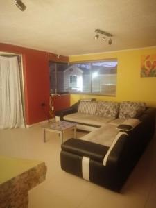 Posezení v ubytování Hatun Wasi + 2 fotografie