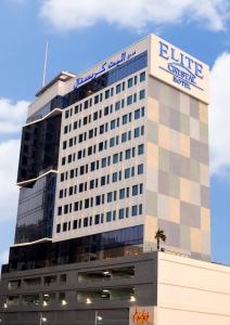 a large building with a large clock on it at Elite Crystal Hotel in Manama