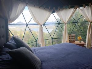 Giường trong phòng chung tại Glamping El Refugio