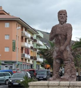 a statue of a man standing on a street at Mar y Sol I Candelaria in Punta Larga