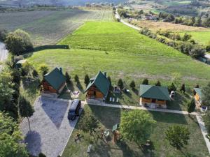 an aerial view of a house in a field at Fruškogorske brvnare in Sremski Karlovci +2 photos