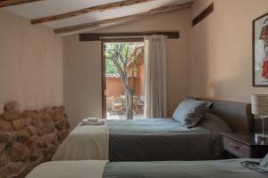 Ένα ή περισσότερα κρεβάτια σε δωμάτιο στο Bungalows Perayoc