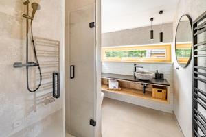 a bathroom with a shower and a sink at Vila Sněženka in Horní Planá +23 photos