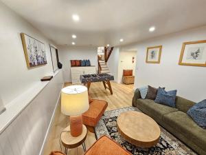 a living room with a couch and a table at Modern Retreat near Six Flags & Naval Base in Waukegan