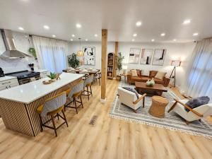 a kitchen and living room with a table and chairs at Modern Retreat near Six Flags & Naval Base in Waukegan