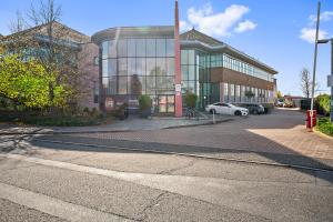 a building with a car parked in front of it at The Cosy Luxe in Slough