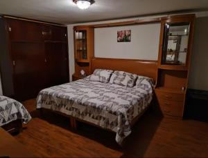 Ένα ή περισσότερα κρεβάτια σε δωμάτιο στο Casa Las orquídeas