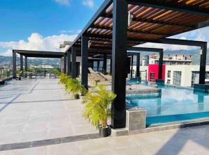 a swimming pool on the roof of a building at Rooftop Pool Condo in Kingston in Kingston +15 photos