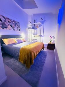 a bedroom with a bed in a purple room at Mood's Home BLQ in Bologna