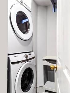 a laundry room with a washer and dryer at Stunning-Luxury-Cozy Private Suite In Ajax in Ajax