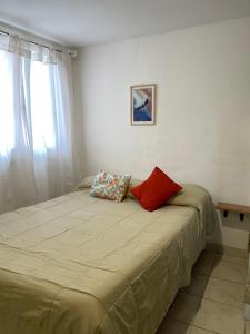 Ένα ή περισσότερα κρεβάτια σε δωμάτιο στο Calafate Viejo Hostel