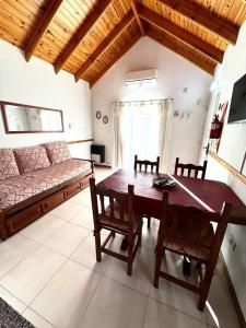 a living room with a table and a couch at Edymar in Puerto Madryn