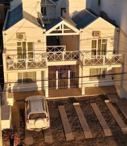 a car parked in front of a house at Edymar in Puerto Madryn