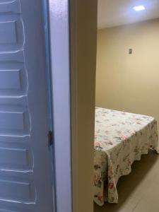 Ένα ή περισσότερα κρεβάτια σε δωμάτιο στο Suíte Casal Confort