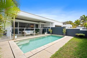 a swimming pool in the backyard of a house at Ocean Breeze on Malibu in Kingscliff