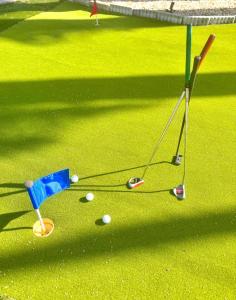a group of golf equipment sitting on the grass at Coral Canal Cove in Cape Coral