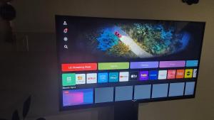 a flat screen tv with a video game on it at Togather Time,5 minutes to HYW 401 in Oshawa