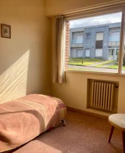 En eller flere senge i et værelse på Hotel de la Poesía