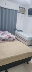 Ένα ή περισσότερα κρεβάτια σε δωμάτιο στο Pousada Panorâmica Tropical- Pé na Areia