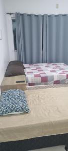 Ένα ή περισσότερα κρεβάτια σε δωμάτιο στο Pousada Panorâmica Tropical- Pé na Areia