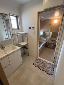 Postel nebo postele na pokoji v ubytování Kuzakura