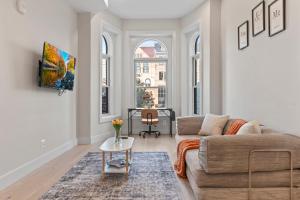 a living room with a couch and a table at Lux 2Bedroom apartment in Washington DC Dupont in Washington