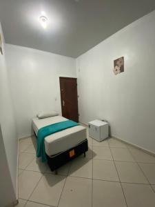 Ένα ή περισσότερα κρεβάτια σε δωμάτιο στο COP30-Suite privativa 700m Hangar +6 φωτογραφίες