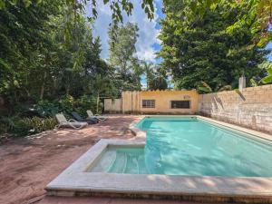 a swimming pool in the backyard of a house at Casa Santa María Valladolid in Valladolid