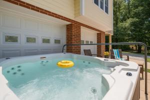 a jacuzzi tub with a donut in it at Kernersville Studio Suite Community Pool Firepit Kitchen in Kernersville