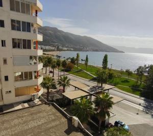 an apartment building with a view of the water at Luka's Apartment in Vlorë