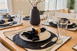 a dining room table with a plate of food on it at 6BR Retreat with Playground Basketball & Sleeps 22 in Star