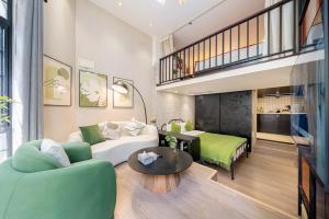 a living room with a couch and a table at 柃居 B&B - Huaihai Middle Road Branch in Shanghai