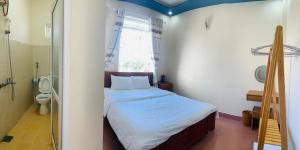 Postel nebo postele na pokoji v ubytování Trà My Villa Đà Lạt BBQ Garden - Nguyên Căn Có Sân Vườn