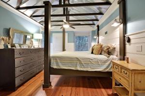 a bedroom with a bed and a dresser and a mirror at PW1310: 1310 Pelican Watch in Seabrook Island +36 photos