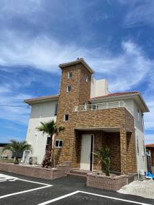 a brick building with a tower on top of it at VOGUE D, a private inn with a panoramic view - Vacation STAY 86199v in Isumi