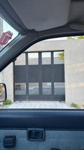 a view from the inside of a car window of a fence at Cazartes puma in Treinta y Tres