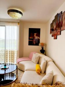 a living room with a couch and a table at Snyder luxe homes 1 in Tatu City