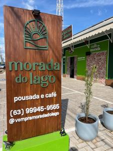 a sign for morada do lago in front of a store at Morada do Lago in Palmas
