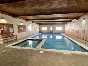 a large indoor swimming pool in a building at Ducks Unlimited 173 in Big Sky